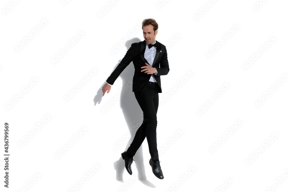 elegant fashion businessman jumping with style in the air