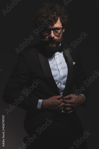 cool businessman looking at the camera with attitude