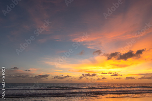 Majestic sunset or sunrise landscape Amazing light of nature cloudscape sky and Clouds moving away rolling .Beautiful Phuket beach is a famous tourist destination in Andaman sea summer. 