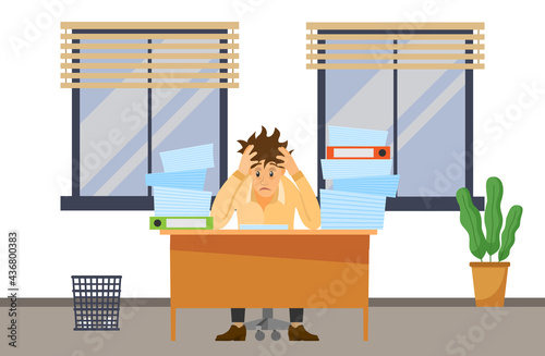Stressed overworked man in pile of office papers and documents trying to finish work on time. Stress and deadline at work. Male office employee is working with documents to deal with deadlines