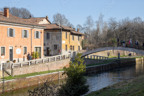 Robecco sul Naviglio ( MI ), Italy - April 01, 2021: Robecco sul Naviglio town and Naviglio Grande, Milano, Lombardy, Italy photo