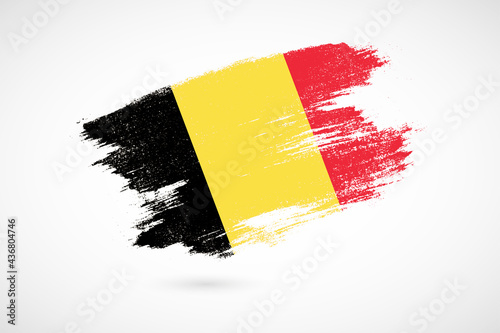 Happy national day of Belgium with vintage style brush flag background