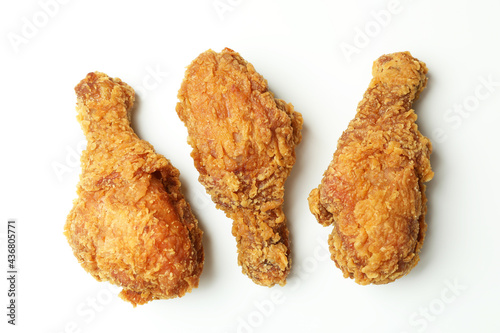 Tasty fried chicken on white background, close up