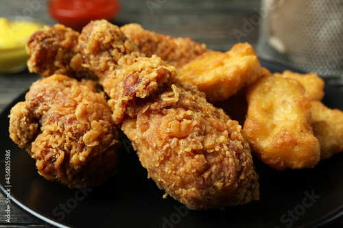 Concept of tasty eating with fried chicken, close up
