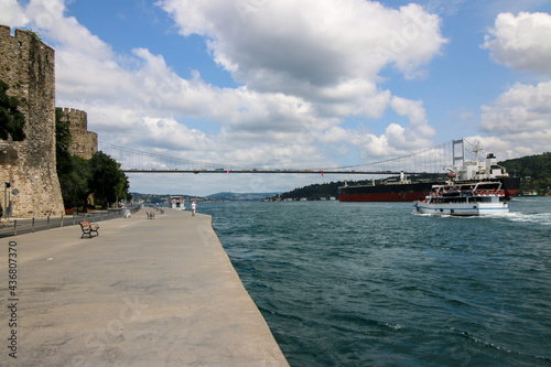 Famous bogazici bridge, Bosporus or Bosphorus in İstanbul, constantinople city, Turkey on blue cloudy sky.  photo
