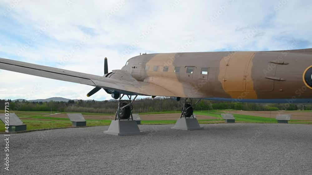 Decommissioned aeroplane, a memorial to partizans and their help to Allied air forces during WWII. Aircraft exhibit in Slovenia. Wide angle, right pan Decommissioned aeroplane, a memorial to partizans and their help to Allied air forces during WWII. Aircraft exhibit in Slovenia. Wide angle, right pan