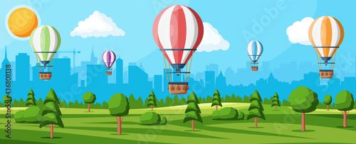 Hot Air Balloon In The Sky With Clouds and Sun. Vintage Air Transport. Nature Outdoor Background. Aerostat With Basket. Nature Landscape Of Green Hills And Cityscape. Flat Vector Illustration