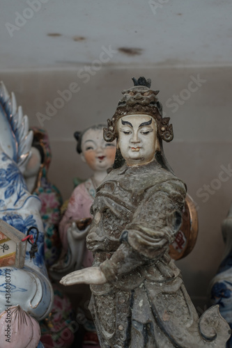 Abandoned ceramic statue photographed in Wah Kwai shrine in Aberdeen, Southern Hong Kong. In the old days, people didn't want to throw away the statues they'd had at and so the shrine was born.