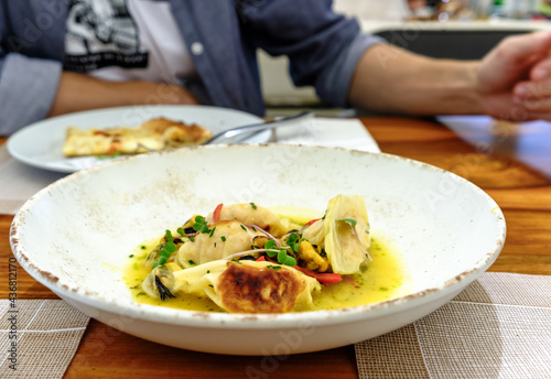 Wallpaper Mural Dumplings Gyoza with crab filling served with mussels and microgreens, top view Torontodigital.ca