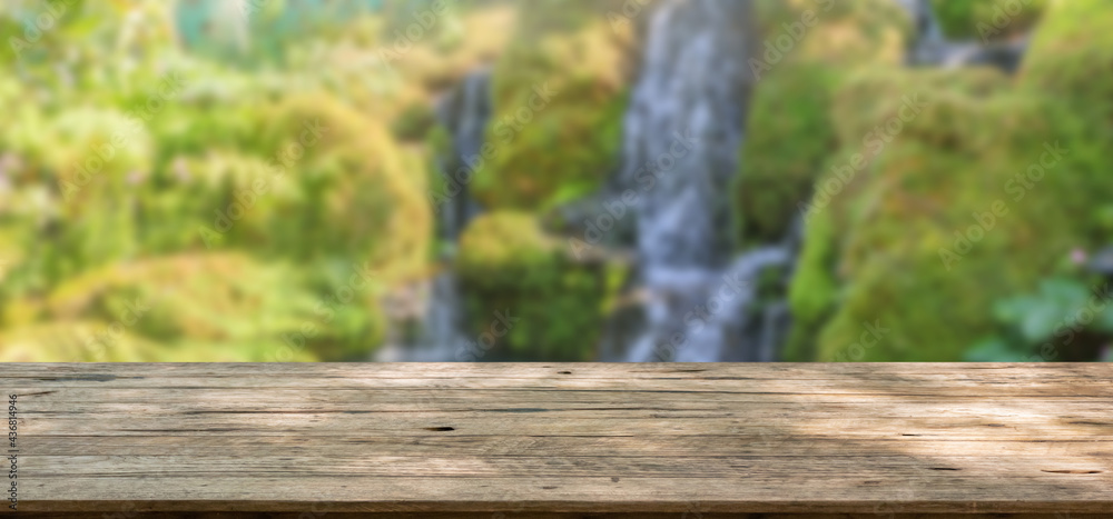 Empty wood table top with abstract blur park garden pond background Empty wood table top with abstract blur park garden pond background