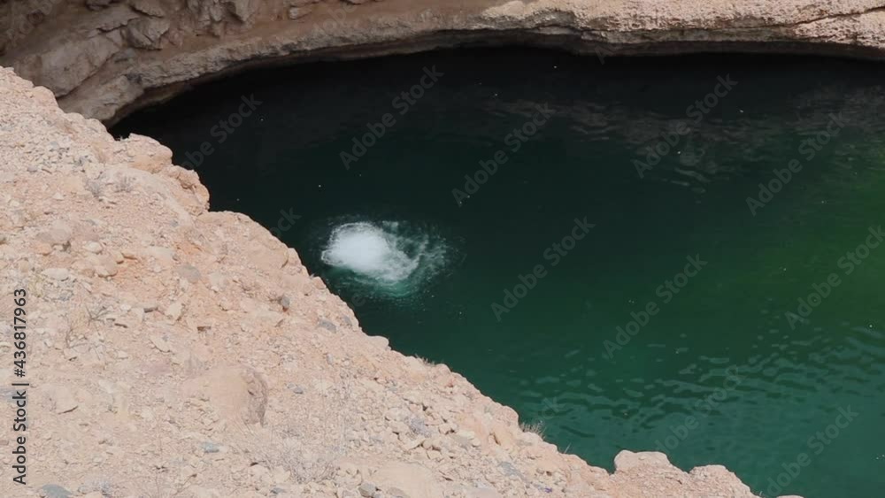 Man Diving into Lake