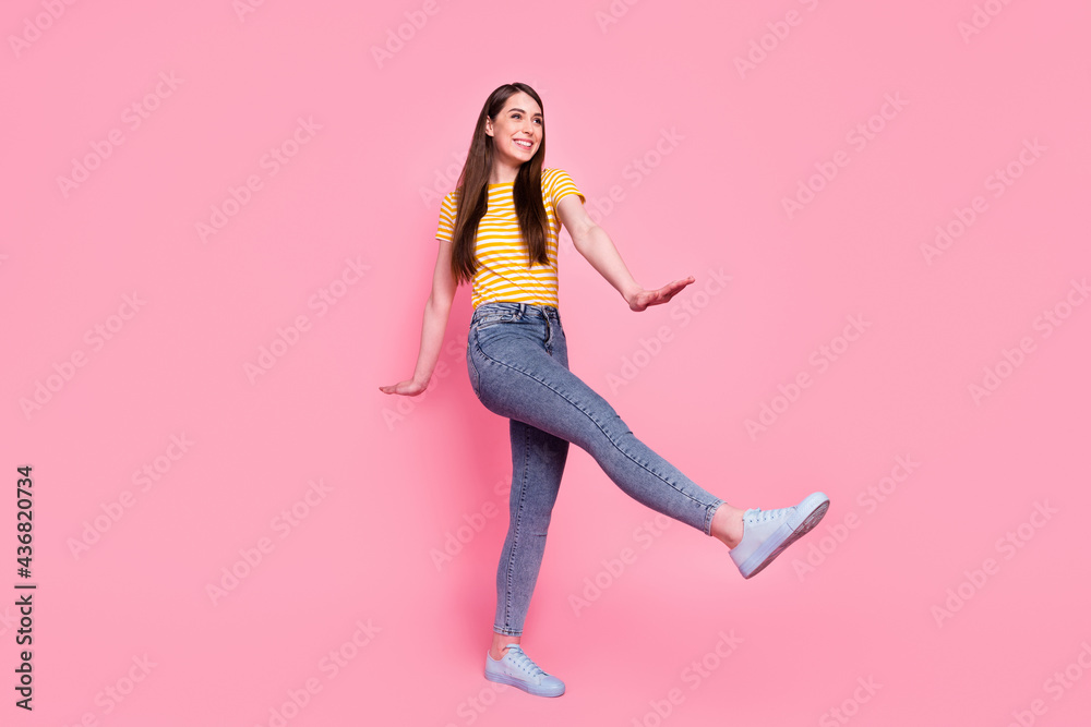 Full body profile side photo of young cheerful girl happy positive smile go walk look empty space isolated over pastel color background Full body profile side photo of young cheerful girl happy positive smile go walk look empty space isolated over pastel color background