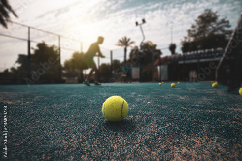 paddle ball on the floor of a court with the background out of focus. ©  Yistocking