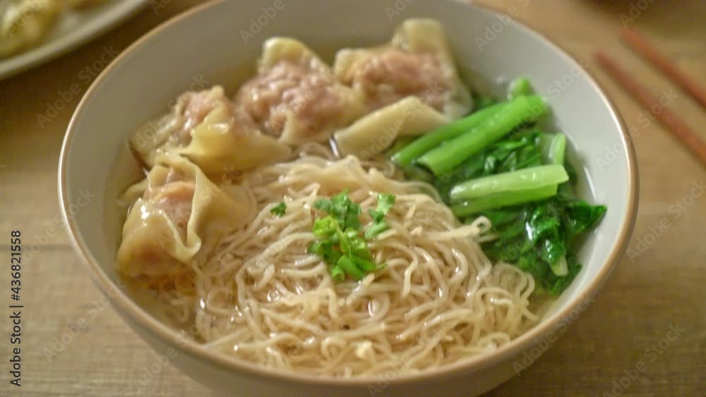 egg noodles with pork wonton soup or pork dumplings soup and vegetable - Asian food style egg noodles with pork wonton soup or pork dumplings soup and vegetable - Asian food style