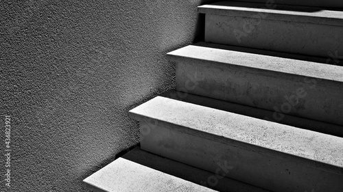 Shadows and lights on a concrete staircase (Marche, Italy, Europe)