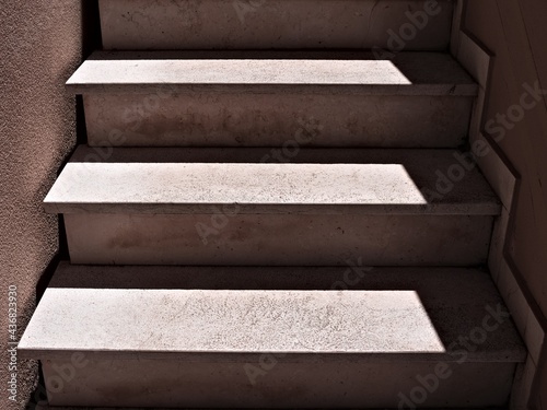 Shadows and lights on a concrete staircase (Marche, Italy, Europe)