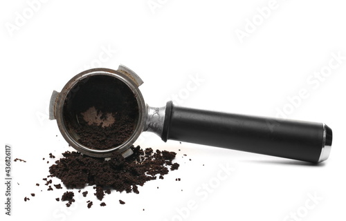 Wall Mural Milled coffee sediment, residue with espresso machine handle, scoop isolated on