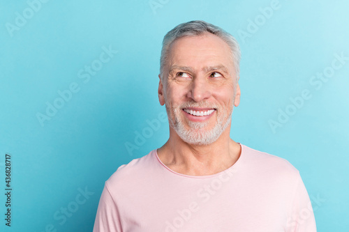Fotografija Photo portrait smiling man in pink t-shirt looking copyspace isolated on pastel