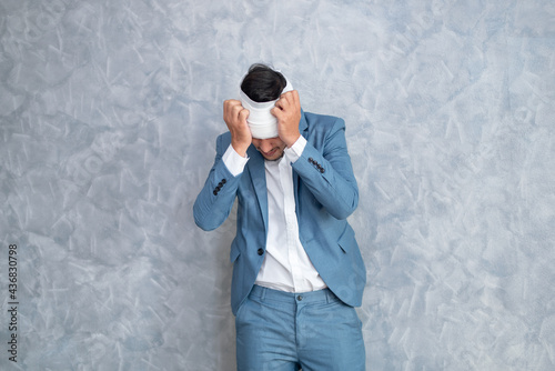 Stressed businessman in suits working in the office, negative emotions