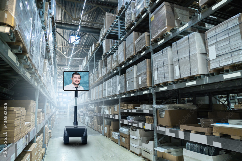 Autonomous robot in a warehouse. Display shows the manager. Concept