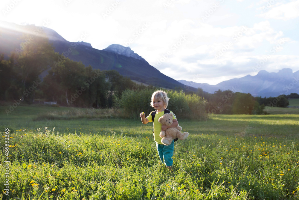 Children hiking in Alps mountains. Kids outdoor Children hiking in Alps mountains. Kids outdoor