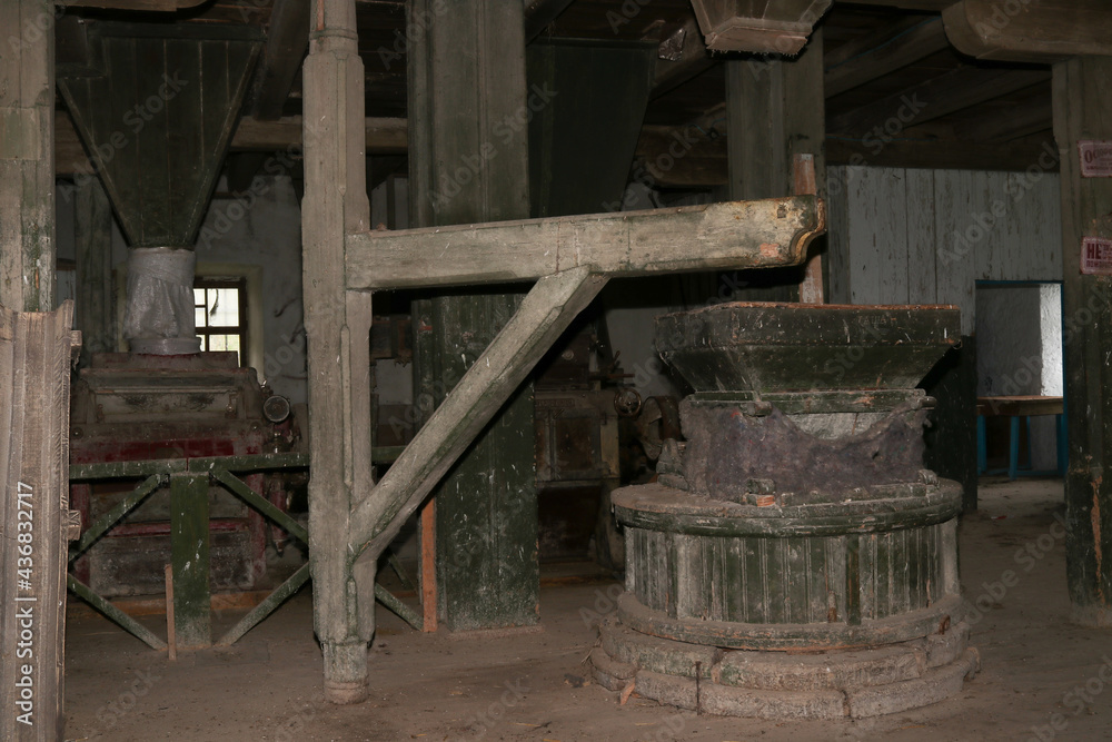 Non-working mechanisms of an old abandoned mill of the 19th century Non-working mechanisms of an old abandoned mill of the 19th century