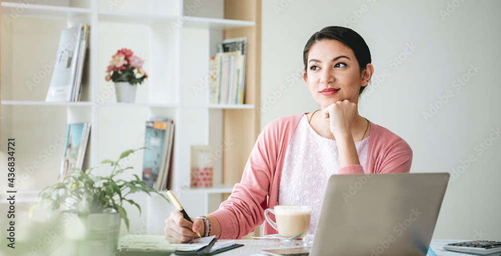 Confident Businesswoman Smiling and thinking Sitting In Modern Office. Confident Businesswoman Smiling and thinking Sitting In Modern Office.