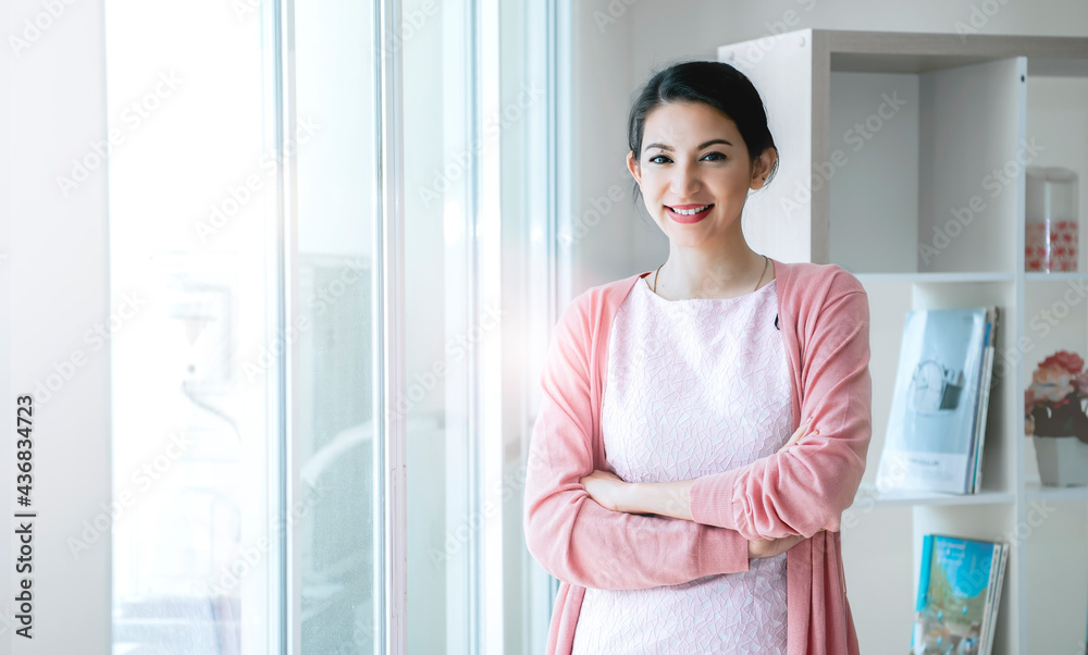 Confident Businesswoman Smiling In Modern Office. Confident Businesswoman Smiling In Modern Office.