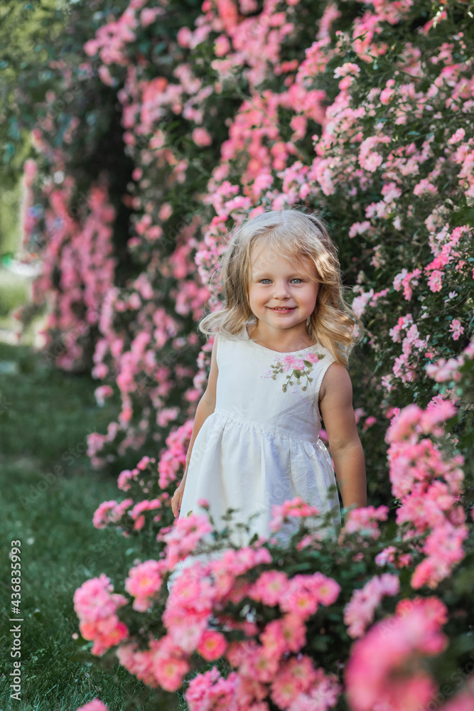 little girl in the flower garden