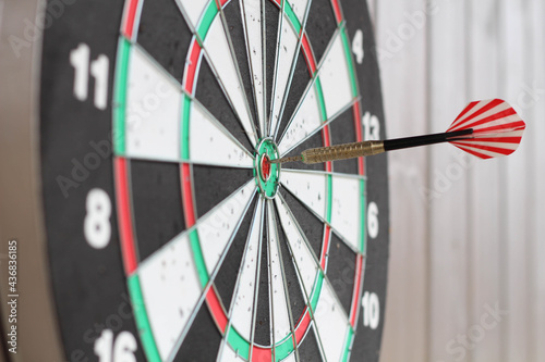 Darts on dart board outdoors. Throw darts at the target. The winner, first place. Business goals