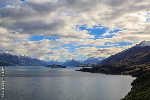 The northern end of Lake Wakatipu, New Zealand, surrounded by the mountains of the Southern Alps. In the water are Tree, Pigeon, and Pig Islands