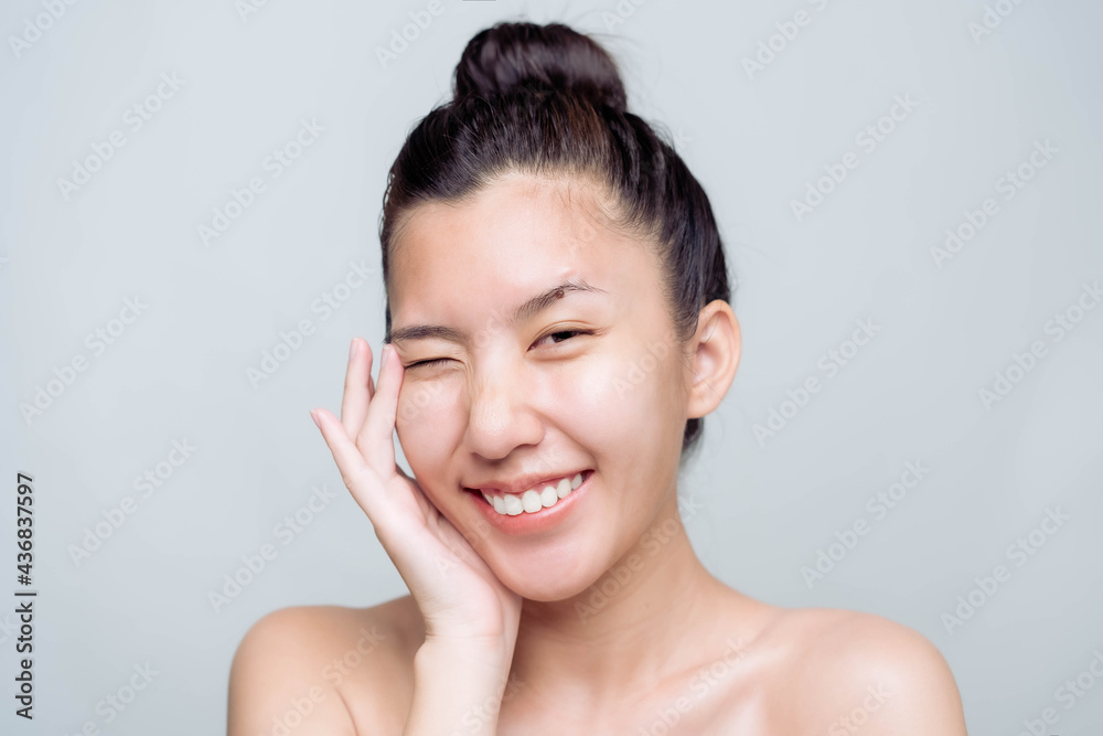 Beautiful young asian woman with clean fresh skin on white background. Asian women portrait.