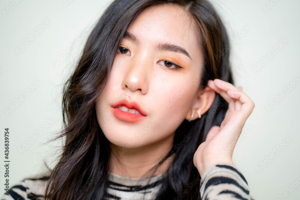 Beautiful young asian woman with clean fresh skin on white background. Asian women portrait. Beautiful young asian woman with clean fresh skin on white background. Asian women portrait.