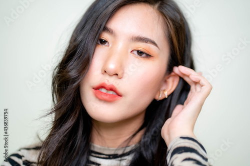 Beautiful young asian woman with clean fresh skin on white background. Asian women portrait.