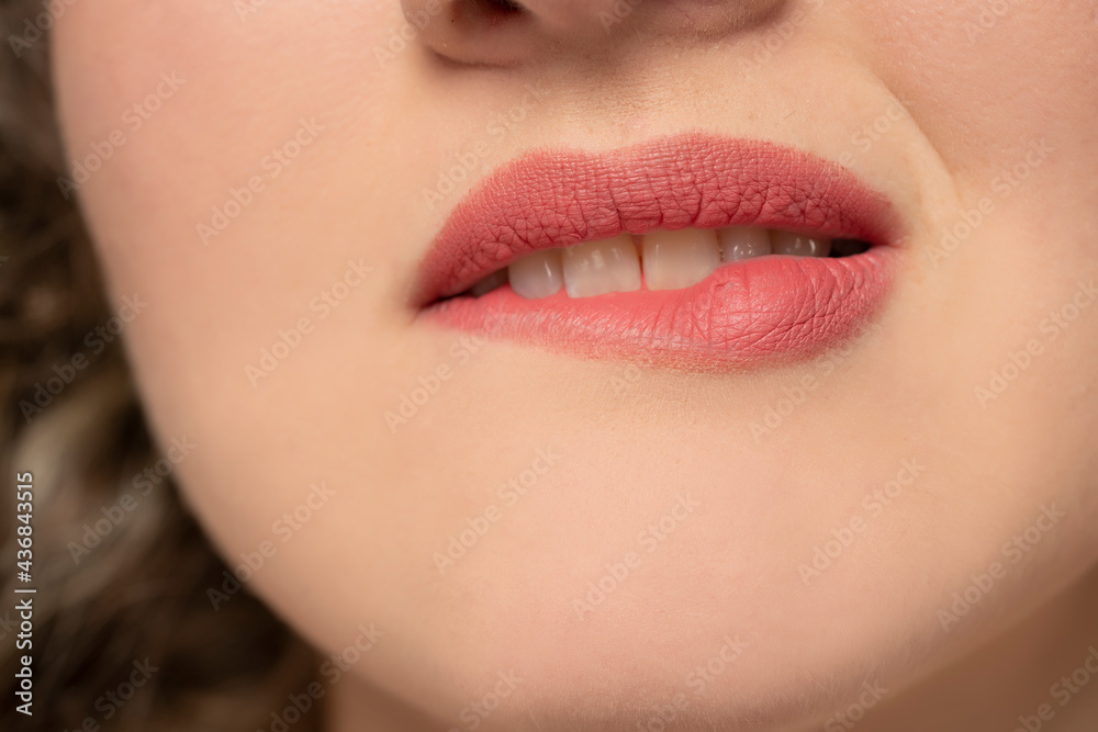 woman biting her lips woman biting her lips