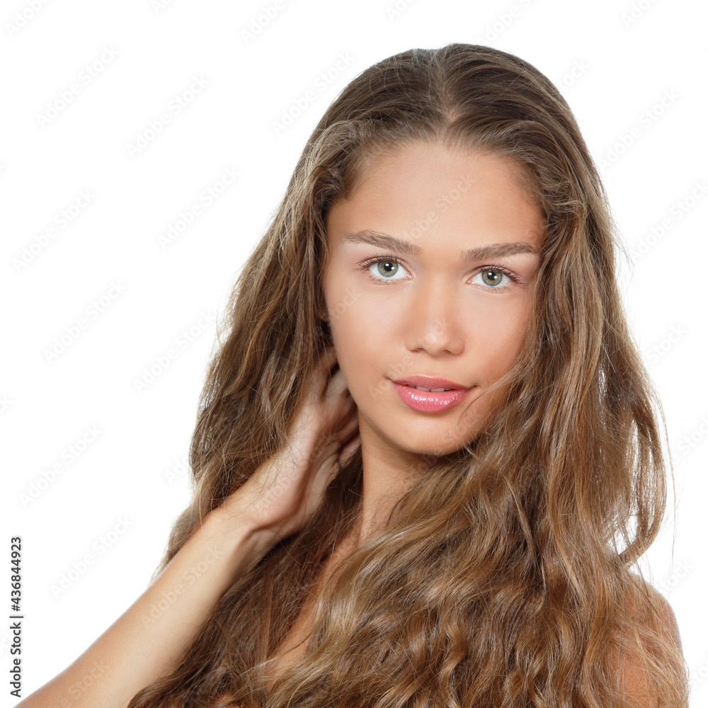 Portrait of a beautiful young woman with clean skin and long curly fair hair, beauty treatment, cosmetology and anti-aging theme Portrait of a beautiful young woman with clean skin and long curly fair hair, beauty treatment, cosmetology and anti-aging theme