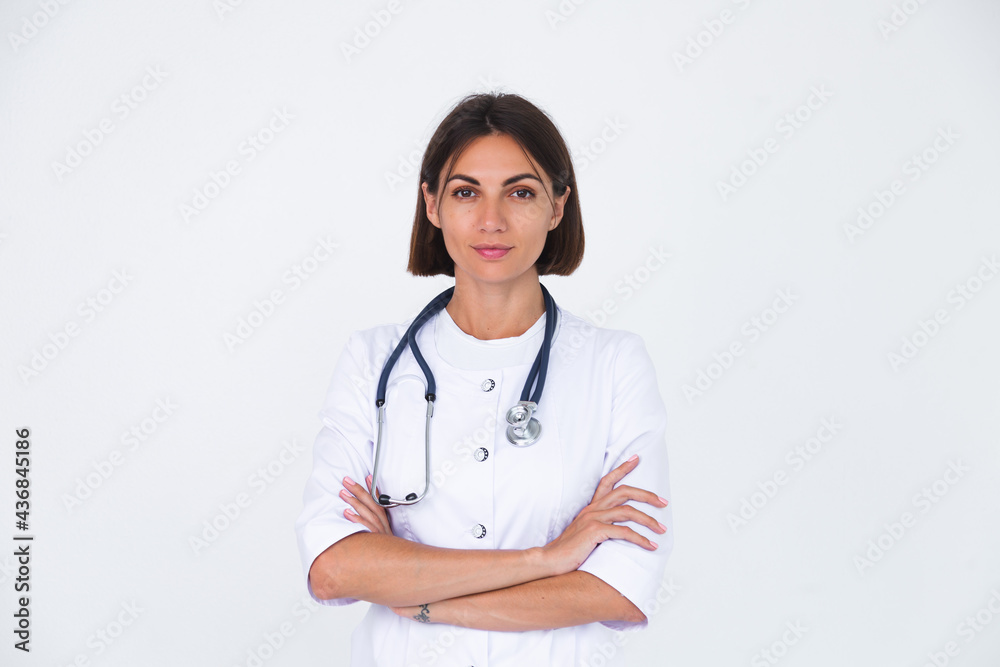 Female doctor in lab coat on white background isolated, confident smile Female doctor in lab coat on white background isolated, confident smile