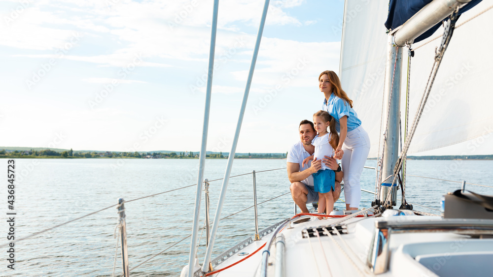 Parents And Daughter Standing On Yacht Deck On Summer Day Parents And Daughter Standing On Yacht Deck On Summer Day