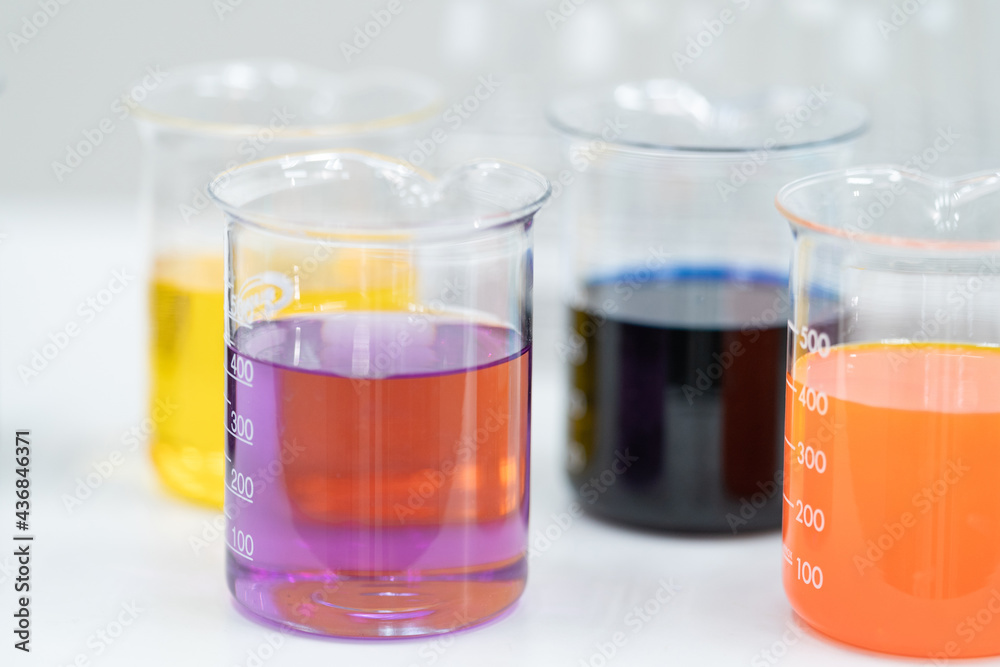 Close-up and selective focus shoot of a microscope, medical test tubes with liquid, and other modern laboratory equipment in a laboratory room. Education stock photo Close-up and selective focus shoot of a microscope, medical test tubes with liquid, and other modern laboratory equipment in a laboratory room. Education stock photo