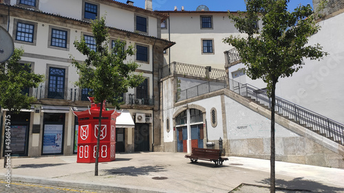 Porto, Portugal - May 30, 2021: Red and White Traditional Kiosk Stand at the Mompilher Square.