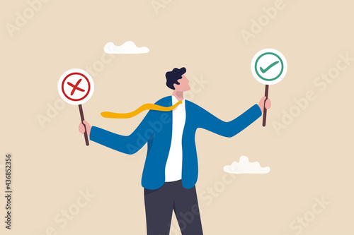 Business decision right or wrong, true or false, correct and incorrect, moral choosing option concept, thoughtful businessman holding right or wrong of left and right hand while making decision. photo
