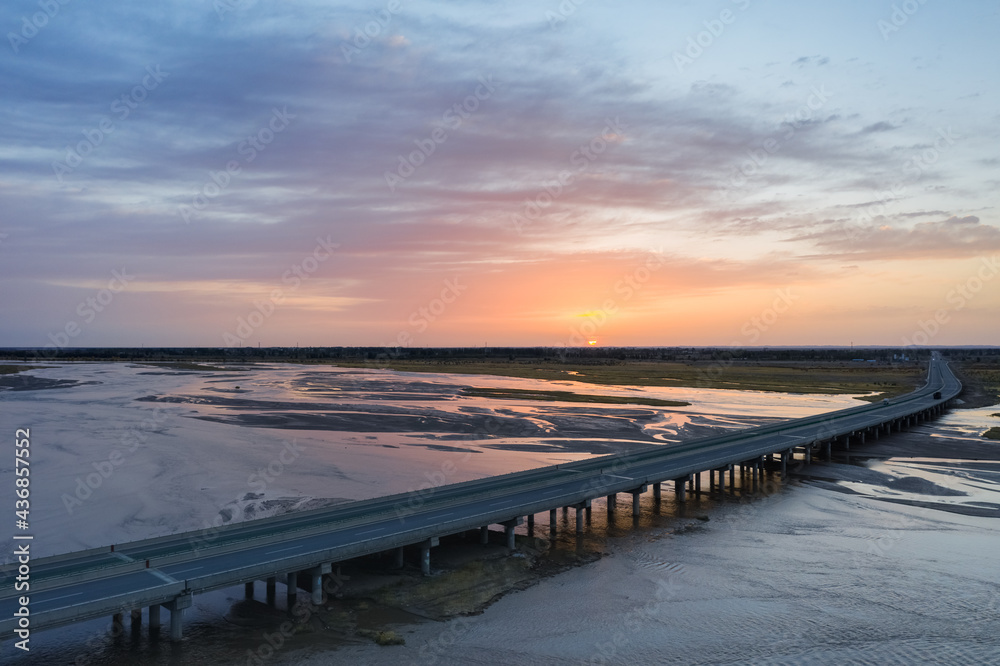 Obraz premium aerial view of the black river in sunrise