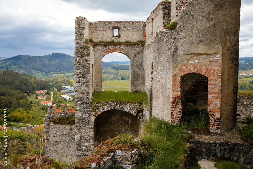 Stone gothic ruins of old medieval castle Rabi in National Park Sumava, ancient fortress in sunny spring day, landmark in countryside, stronghold on the hill, Rabi, Czech Republic
