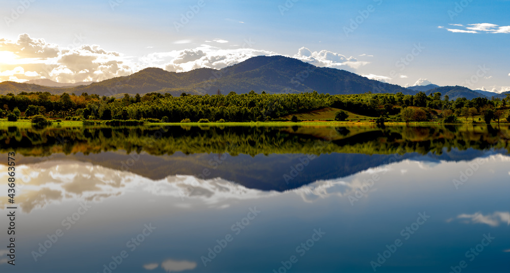 Mountain scenery reflection lake evening sunlight in thailand