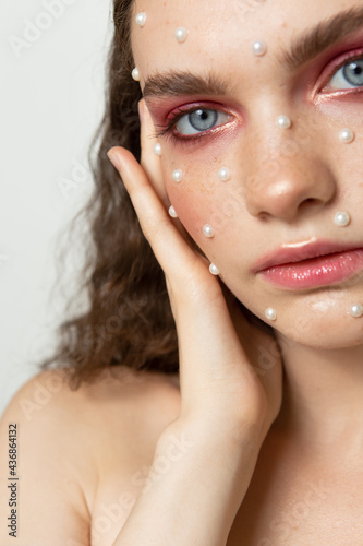 Fotografie Creative portrait of a girl with clean skin and makeup and hairstyle