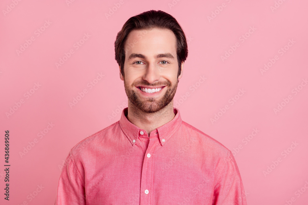 Photo of happy attractive charming young man smile good mood cheerful isolated on pastel pink color background