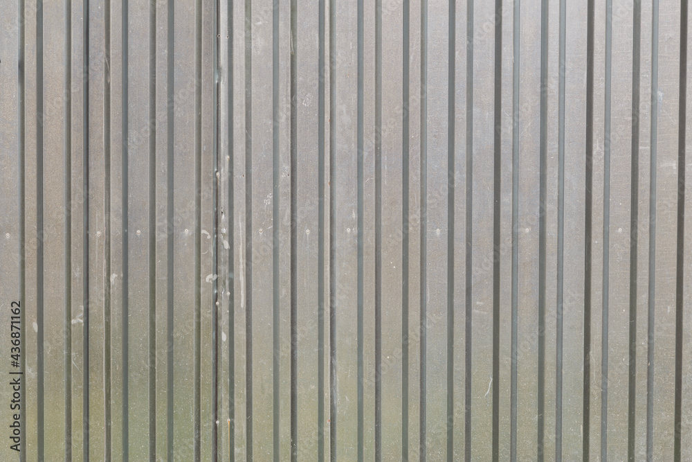 Metal sheet profile surface. Close-up of gray steel panel Metal sheet profile surface. Close-up of gray steel panel