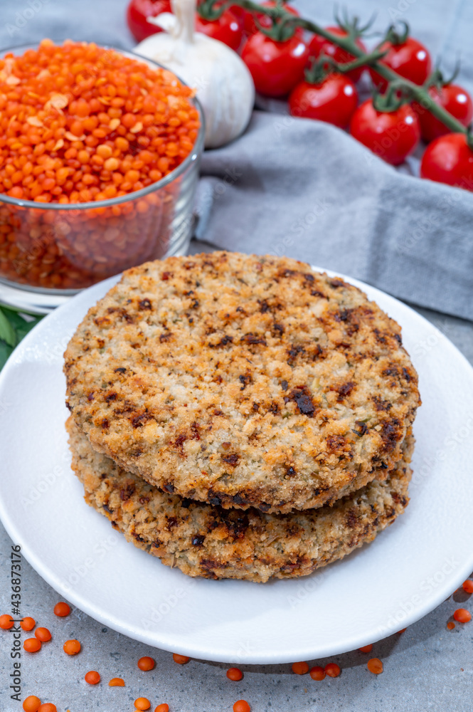 Healthy vegetarian or vegan food, meat free burger made from orange lentils legumes