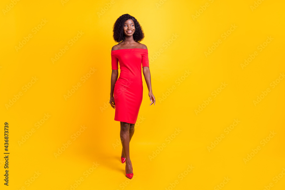 Full body photo of gorgeous dark skin girl look empty space bare shoulders isolated on yellow color background