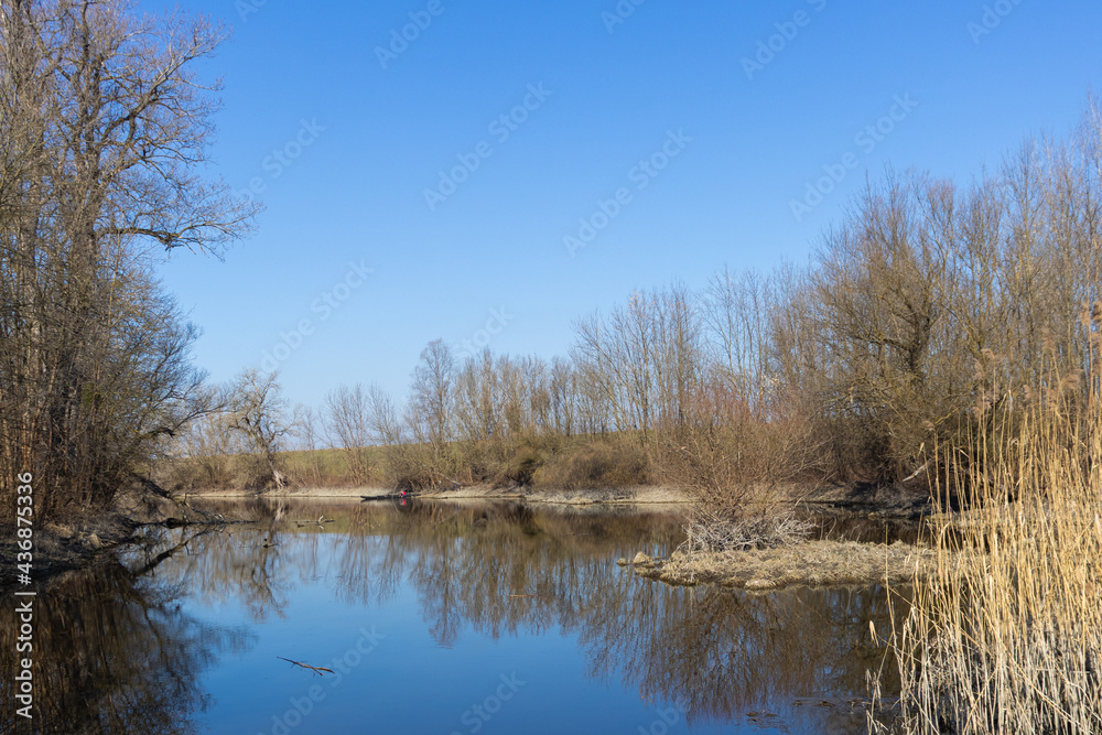 View of the river bank with blue sky 
